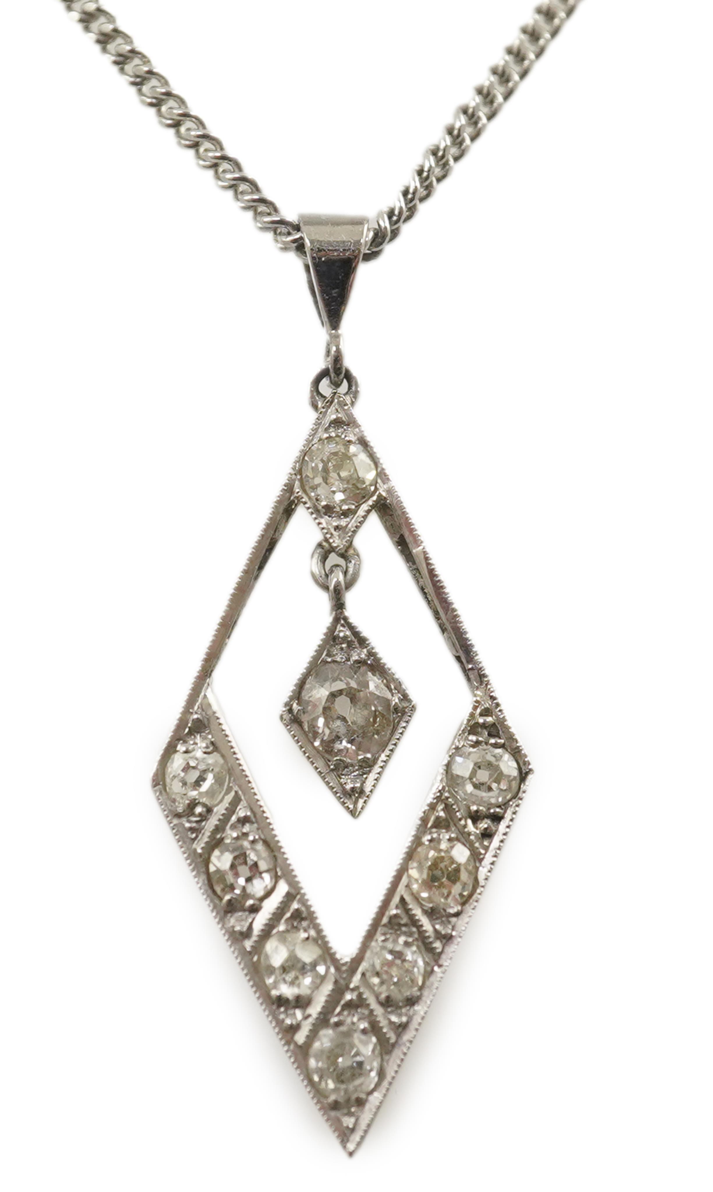 A 1940's white gold? and millegrain set diamond cluster drop pendant